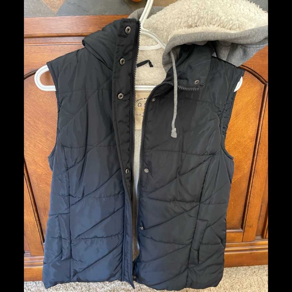 Fuzzy vest with hood. Size large.